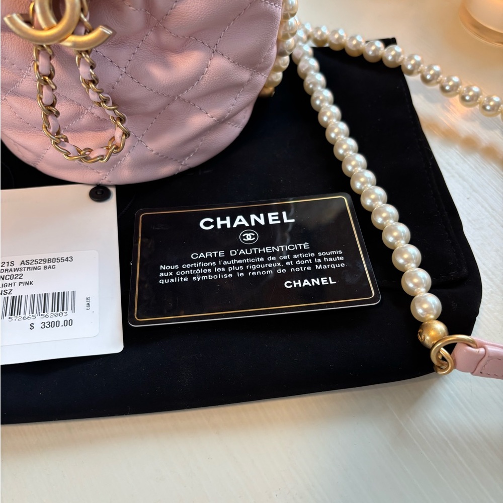 CHANEL Light Pink Quilted Mini Drawstring Bag with Pearl Chain. Never Used. - Picture 12 of 16
